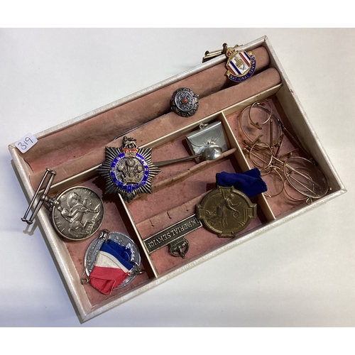 319 - A box containing silver war medals, badges etc. Est. £20 - £30.