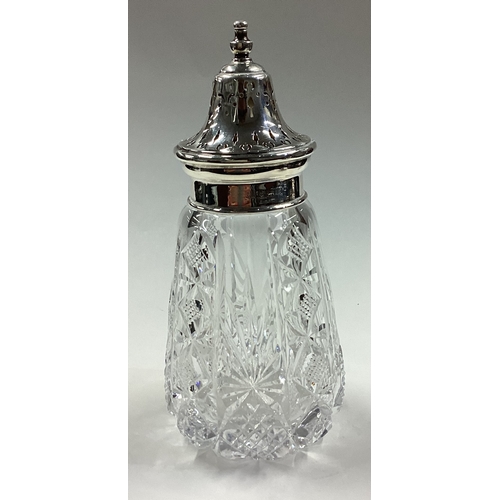 325 - A large silver mounted and glass sugar caster. Birmingham 1967. By B & Co. Est. £30 - £40.