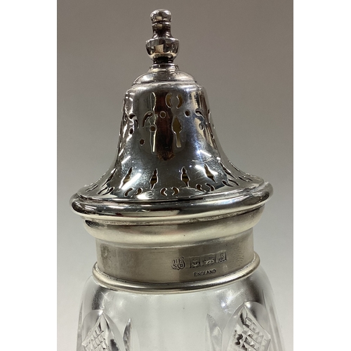 325 - A large silver mounted and glass sugar caster. Birmingham 1967. By B & Co. Est. £30 - £40.