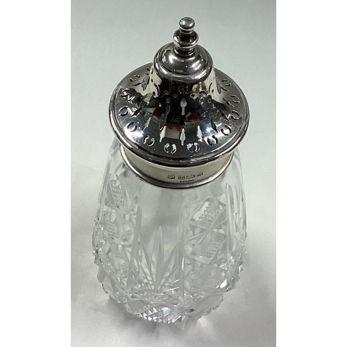 325 - A large silver mounted and glass sugar caster. Birmingham 1967. By B & Co. Est. £30 - £40.