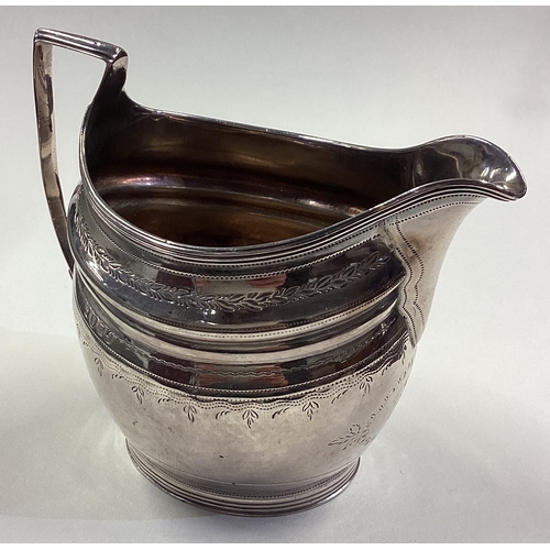 33 - A fine George III silver jug with bright-cut decoration. London 1801. Approx. 139 grams. Est. £120 -... 