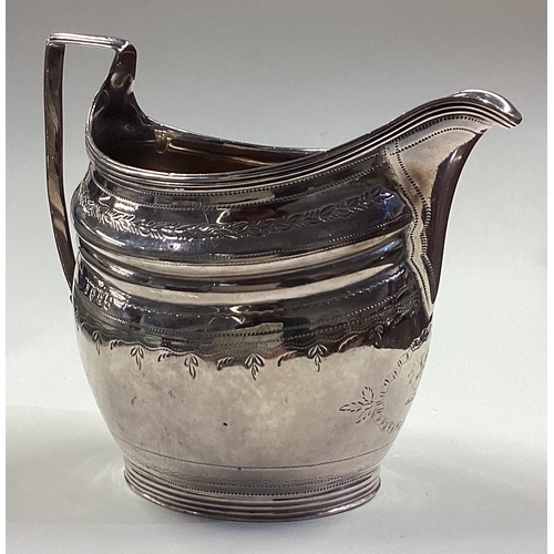 33 - A fine George III silver jug with bright-cut decoration. London 1801. Approx. 139 grams. Est. £120 -... 