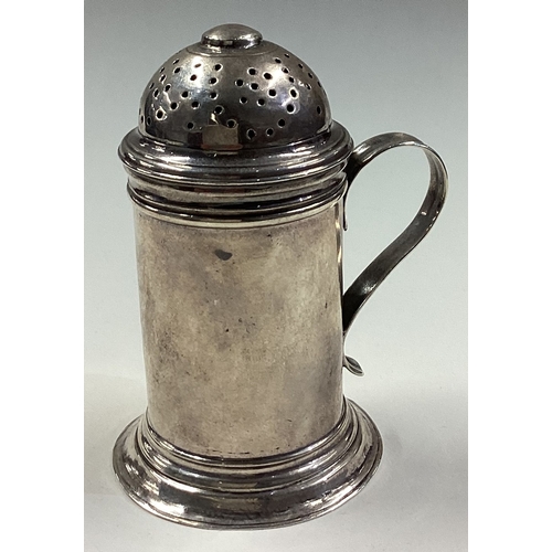 333 - An 18th Century silver kitchen pepper with handle. London 1727. Approx. 80 grams. Est. £250 - £300.