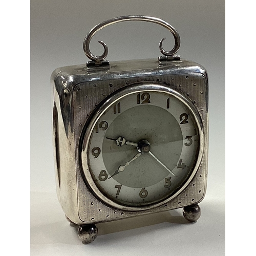 334 - A silver mounted clock with hinged cover. Birmingham 1909. Approx. 334 grams of gross weight. Est. £... 