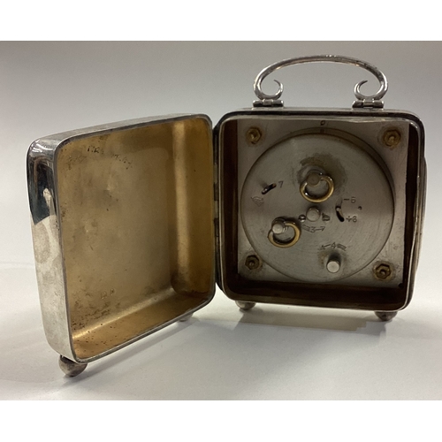 334 - A silver mounted clock with hinged cover. Birmingham 1909. Approx. 334 grams of gross weight. Est. £... 