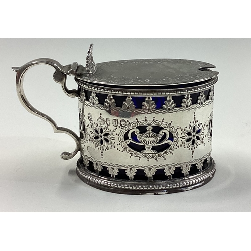 336 - A Victorian silver mustard pot with pierced decoration. London 1883. By Joseph & John Angel. Approx.... 