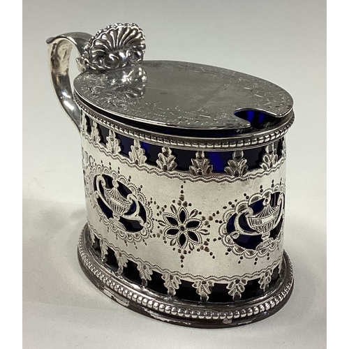 336 - A Victorian silver mustard pot with pierced decoration. London 1883. By Joseph & John Angel. Approx.... 