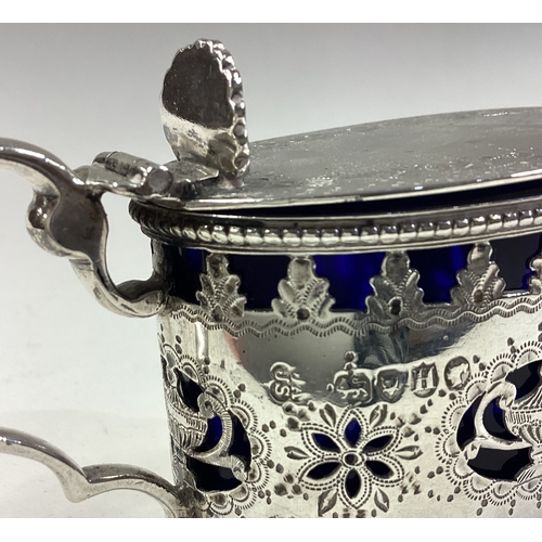 336 - A Victorian silver mustard pot with pierced decoration. London 1883. By Joseph & John Angel. Approx.... 