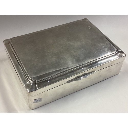 337 - A large Continental silver hinged top cigarette box with cut corners. Approx. 630 grams of gross wei... 