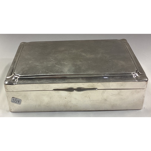 337 - A large Continental silver hinged top cigarette box with cut corners. Approx. 630 grams of gross wei... 