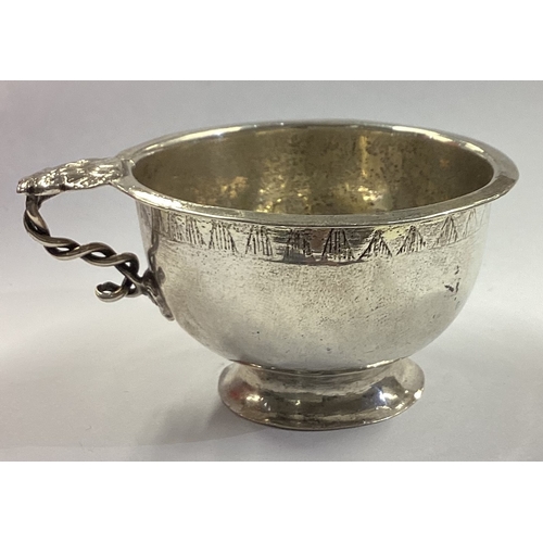 352 - An 18th Century silver beaker with handle. Marked to base. Approx. 36 grams. Est. £200 - £300.