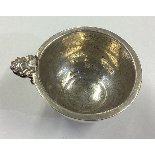 352 - An 18th Century silver beaker with handle. Marked to base. Approx. 36 grams. Est. £200 - £300.