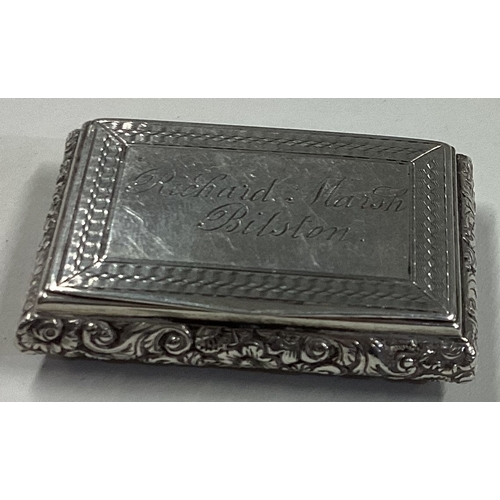 362 - A Victorian silver snuff box with chased decoration. Birmingham. By TS. Approx. 41 grams. Est. £100 ... 