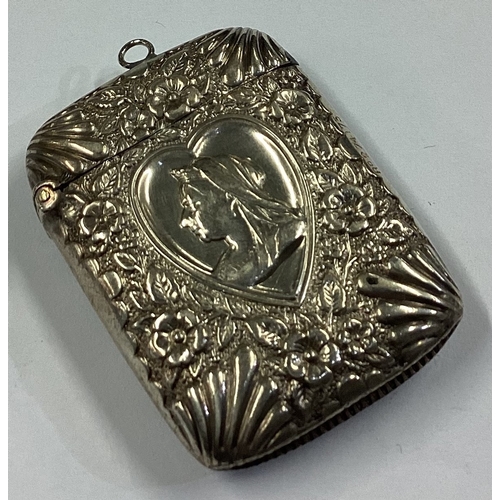 385 - A good quality Victorian silver vesta case with chased decoration depicting Queen Victoria. Birmingh... 