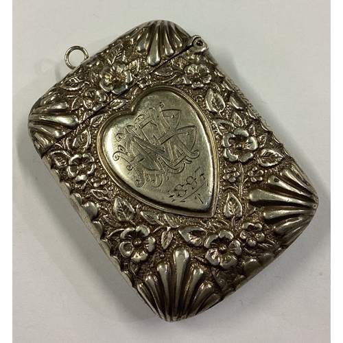 385 - A good quality Victorian silver vesta case with chased decoration depicting Queen Victoria. Birmingh... 