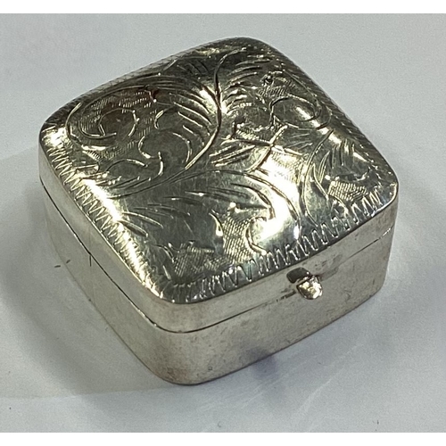 39 - An engraved silver pill box with hinged lid bearing English import marks. Fully marked to base. Appr... 