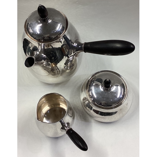 391 - GEORG JENSEN: A fine three-piece silver tea service. Each piece fully marked to base. Approx. 693 gr... 