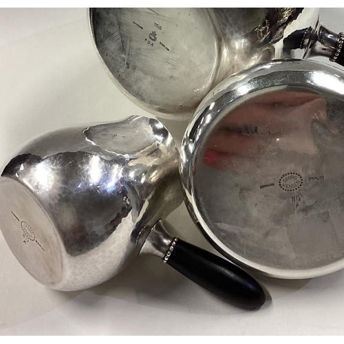 391 - GEORG JENSEN: A fine three-piece silver tea service. Each piece fully marked to base. Approx. 693 gr... 