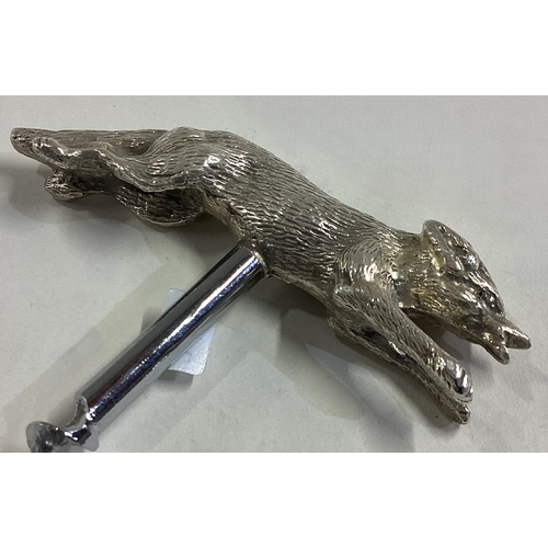 396 - A silver corkscrew in the form of a fox. Birmingham 1968. Approx. 80 grams. Est. £250 - £300.