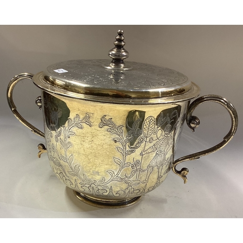 405 - A fine and rare Chinoiserie silver cup and cover. London 1938. By C J Vander. Approx. 1064 grams. Es... 