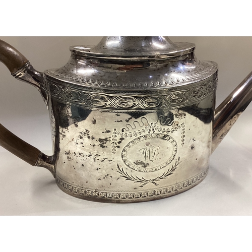 412 - EDINBURGH: A large and oversized 18th Century George III Scottish silver teapot with bright-cut deco... 