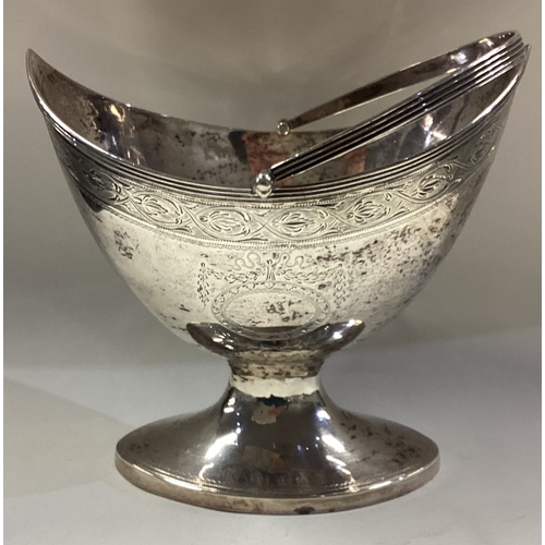 413 - EDINBURGH: A large and oversized 18th Century George III Scottish silver swing handled basket with b... 