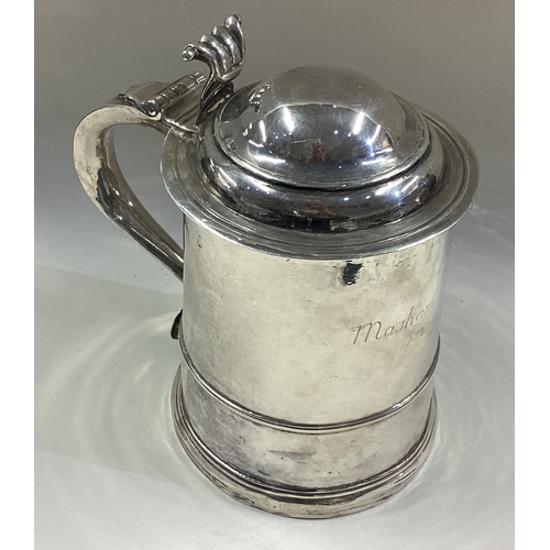 419 - A George I silver lidded tankard. 1724. Approx. 521 grams. Est. £1500 - £2000.