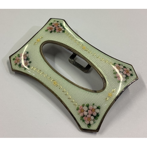 42 - A fine silver and enamelled buckle decorated with flowers bearing import marks. By GV & Co. Approx. ... 