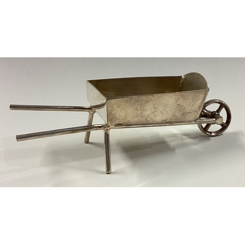 427 - A silver plated model of a wheelbarrow. Est. £10 - £20.