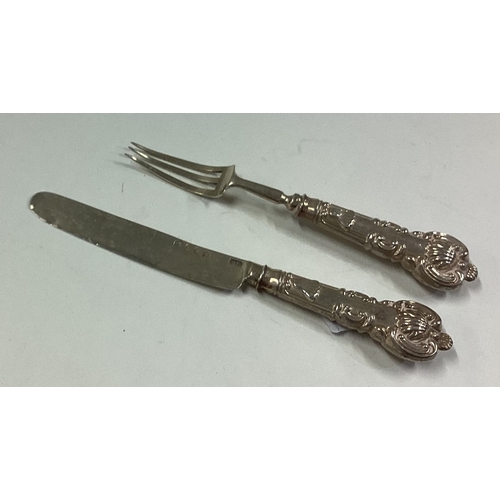 430 - A miniature Georgian silver knife and fork. Birmingham. Approx. 13 grams. Est. £30 - £40.