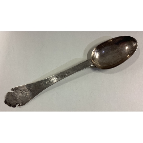 443 - A Continental silver spoon. Marked to base. Approx. 46 grams. Est. £40 - £60.