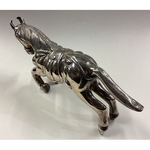 447 - A large silver figure of a horse. Approx. 227 grams. Est. £250 - £300.