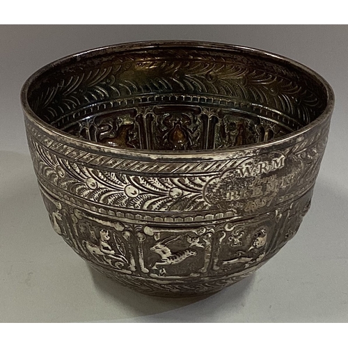 452 - A chased silver sugar bowl with floral decoration. London. Approx. 95 grams. Est. £50 - £80.