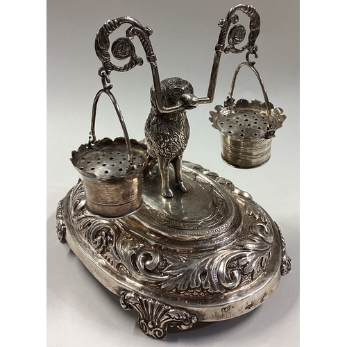 458 - A Portuguese silver toothpick holder with figure of a dog holding a milkmaid's yoke and pails. Appro... 