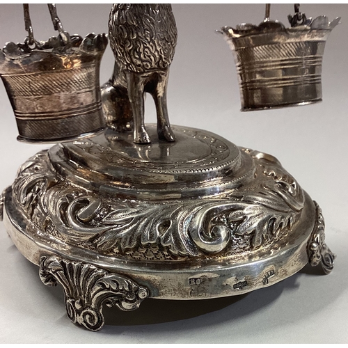 458 - A Portuguese silver toothpick holder with figure of a dog holding a milkmaid's yoke and pails. Appro... 