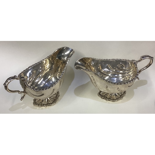 468 - A good pair of heavy silver sauceboats in the Georgian style. London. Approx. 768 grams. Est. £400 -... 