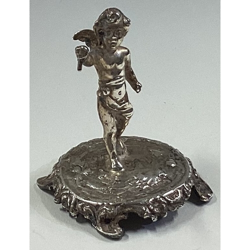 469 - A silver toy figure of Cupid bearing import marks. London 1902. Approx. 26 grams. Est. £30 - £40.