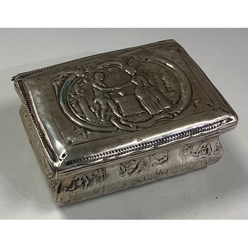 495 - An 18th Century Dutch silver snuff box chased with marriage scene. Marked to side. Approx. 55 grams.... 