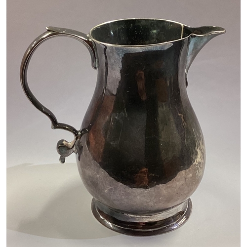 51 - A George I silver sparrow beak pitcher cream jug. London 1729. Approx. 63 grams. Est. £200 - £300.