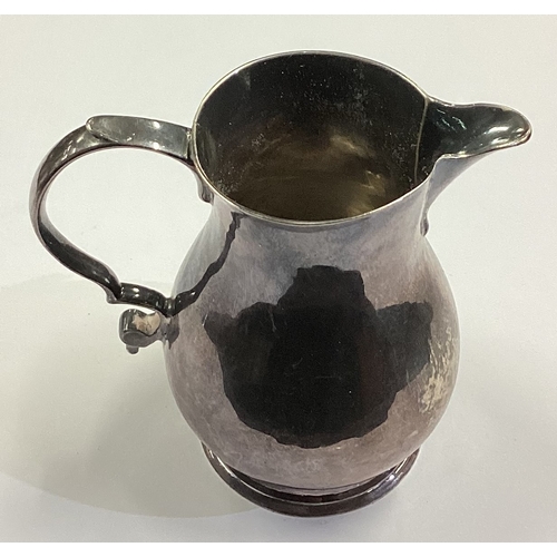 51 - A George I silver sparrow beak pitcher cream jug. London 1729. Approx. 63 grams. Est. £200 - £300.