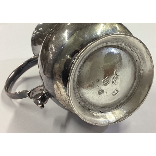 51 - A George I silver sparrow beak pitcher cream jug. London 1729. Approx. 63 grams. Est. £200 - £300.