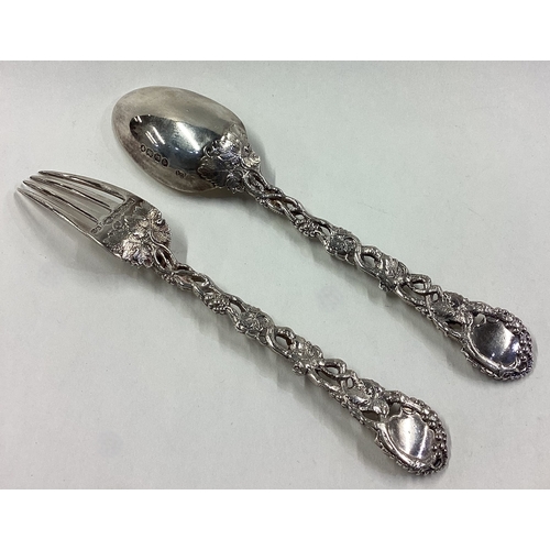 538 - A Victorian silver vine pattern fork and spoon. London 1862. By George Adams. Approx. 95 grams. Est.... 