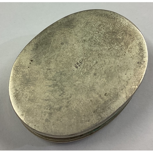 553 - A large and heavy engraved silver pill box bearing import marks. Approx. 19 grams. Est. £20 - £30.