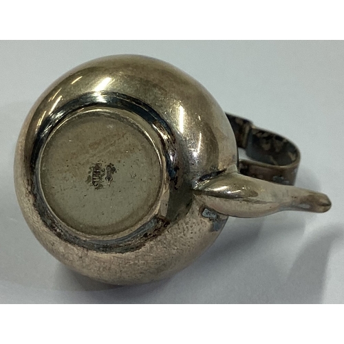 554 - An Antique silver toy kettle. Approx. 15 grams. Est. £30 - £40.