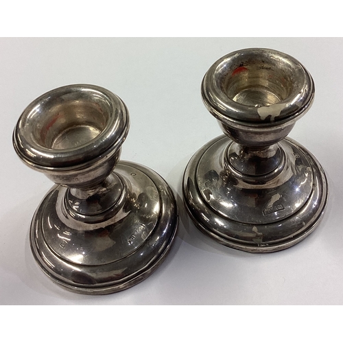 558 - A pair of silver candlesticks. Birmingham 1994. Approx. 136 grams of gross weight. Est. £40 - £60.