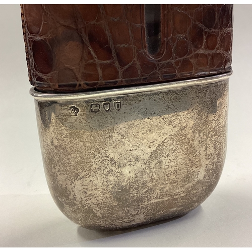 593 - A silver and crocodile skin flask. London 1895. Approx. 294 grams. Est. £100 - £150.