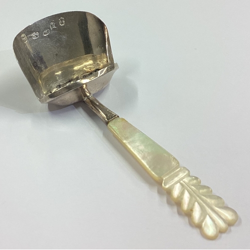 61 - A silver and MOP caddy scoop. Birmingham 1824. By Joseph Wilmore. Approx. 9 grams. Est. £80 - £120.