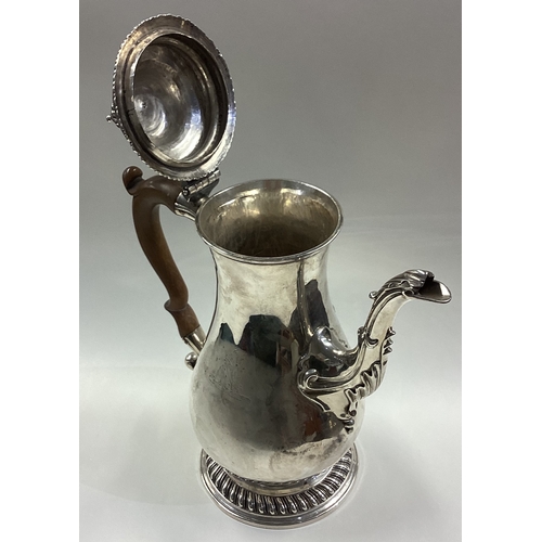 63 - A large George III silver coffee pot with central armorial. London 1764. Approx. 934 grams. Est. £70... 