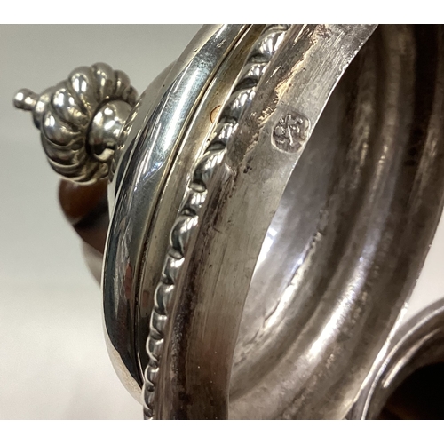 63 - A large George III silver coffee pot with central armorial. London 1764. Approx. 934 grams. Est. £70... 