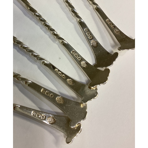 637 - A heavy set of six silver teaspoons with scroll mounts. Sheffield. Approx. 83 grams. Est. £30 - £40.